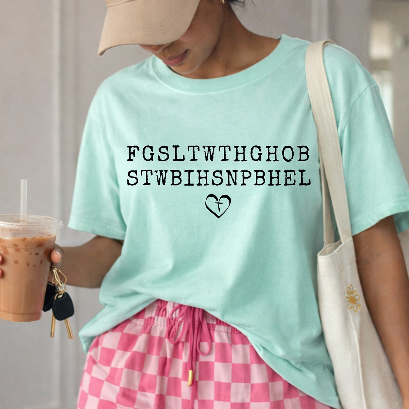 Ready to press white John 3:16 Bible verse acronym DTF transfer featuring the letters FGSLTWTHGHOB STWBIHSNPBHEL with a cross heart graphic, pressed onto a vintage blue mineral wash crewneck sweatshirt.