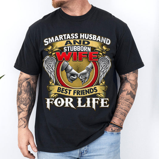 Smartass Husband and Stubborn Wife Best Friends for Life DTF transfer with gold banners, red lettering, angel wings, and pinky promise design on a black T-shirt.