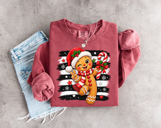 Cute winking gingerbread Christmas DTF transfer with Santa hat candy cane scarf and black white striped background