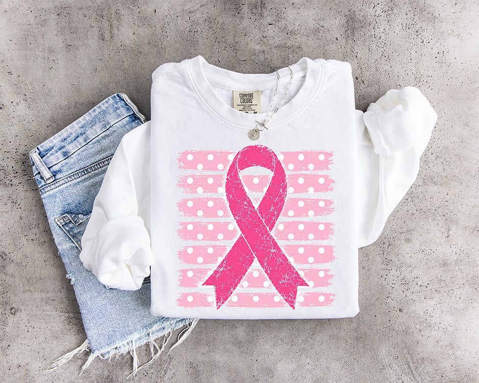Breast Cancer Awareness pink ribbon DTF transfer featuring a distressed bright pink ribbon over a pink and white polka dot background