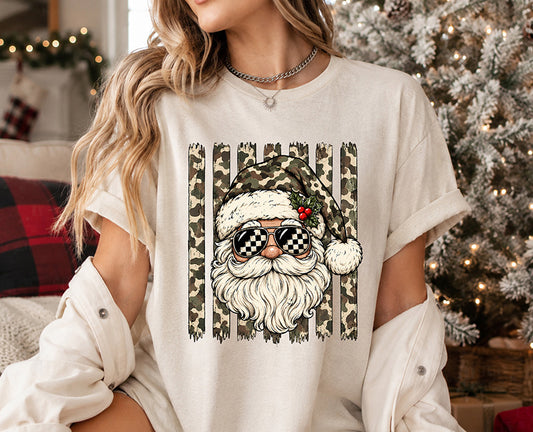 Camo Santa Christmas DTF transfer featuring Santa in a camouflage hat with black and white checkerboard sunglasses and distressed camo stripes