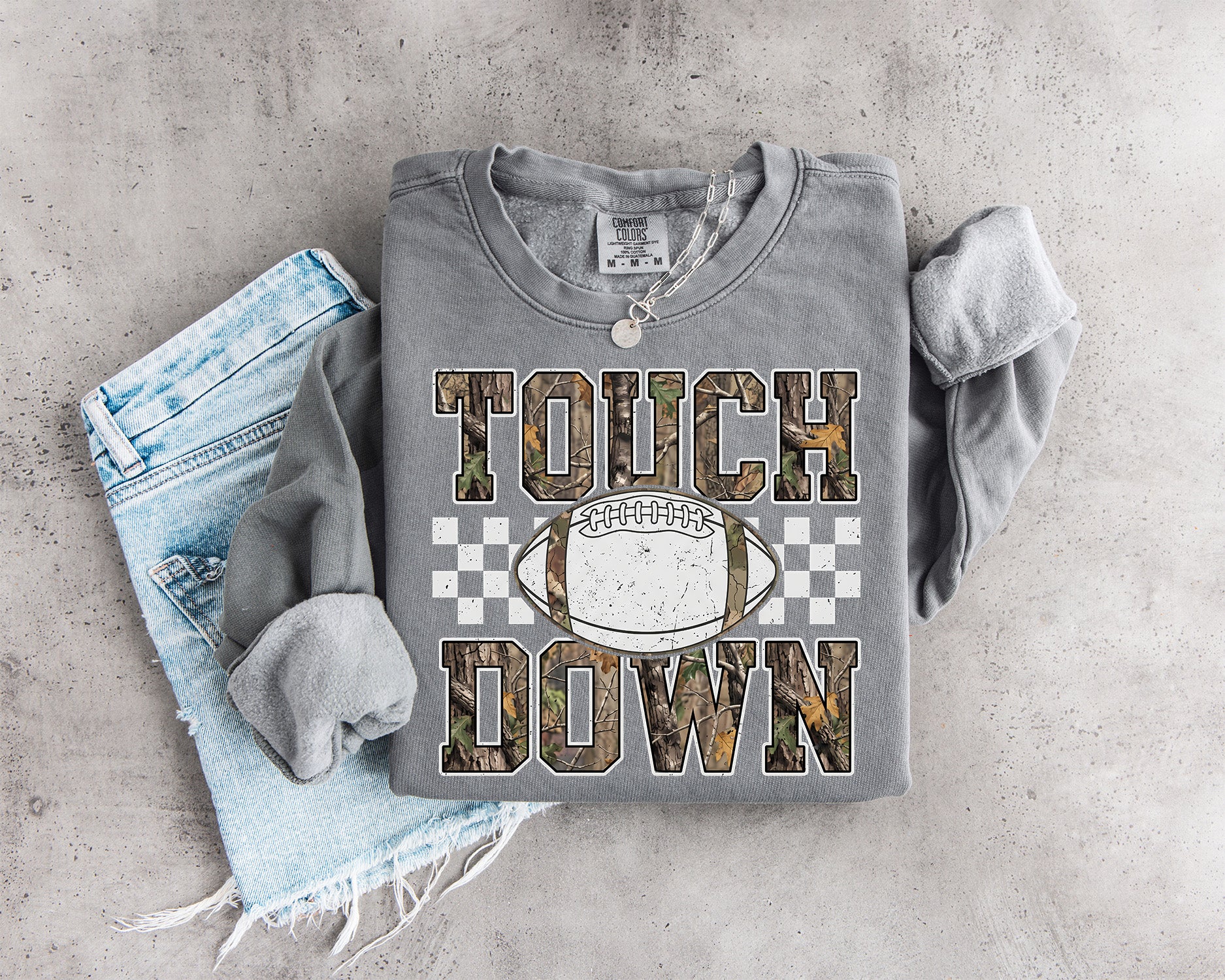 Camo Touchdown Football DTF transfer with woodland camouflage varsity lettering, distressed football and checkerboard game day accents
