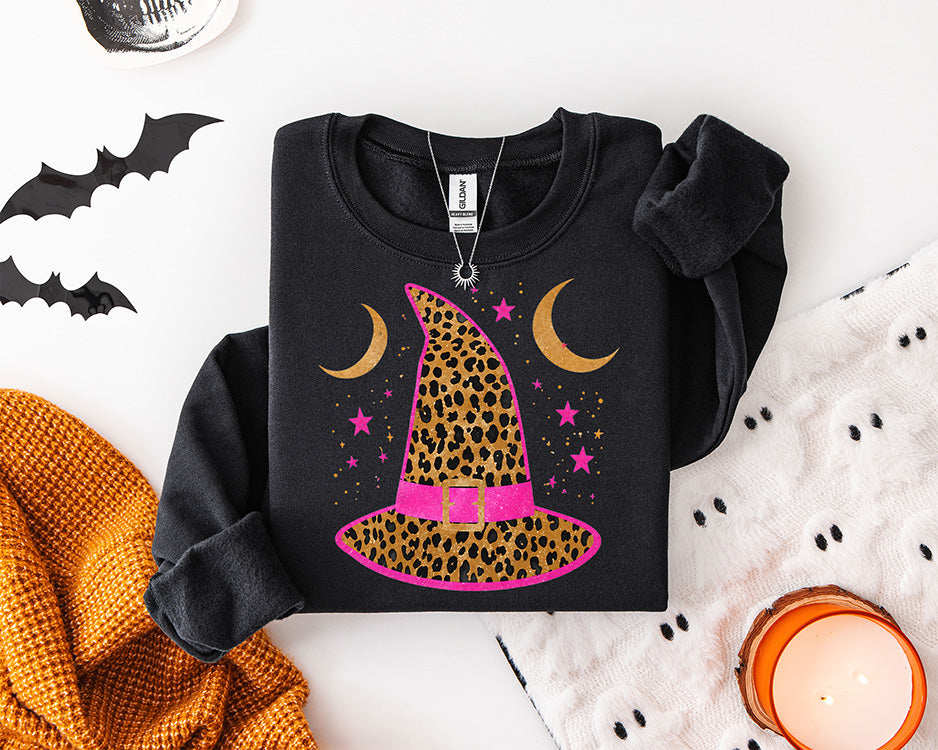 Leopard print witch hat DTF transfer with hot pink band crescent moons and stars for trendy Halloween apparel