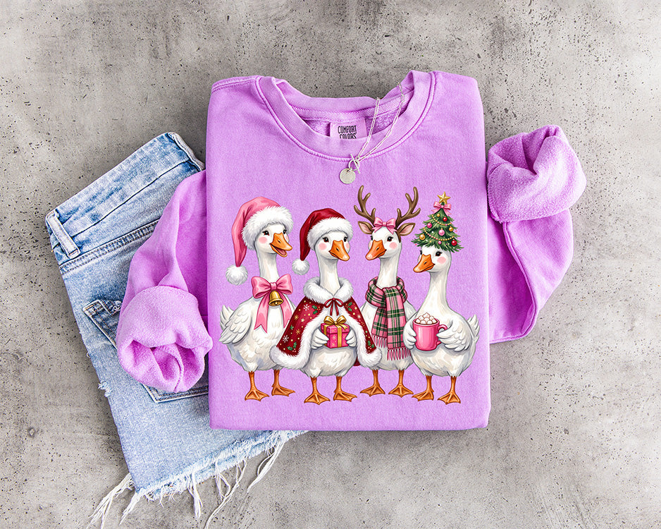 Cute Christmas geese DTF transfer with Santa hats pink bows reindeer antlers plaid Christmas tree present and hot cocoa