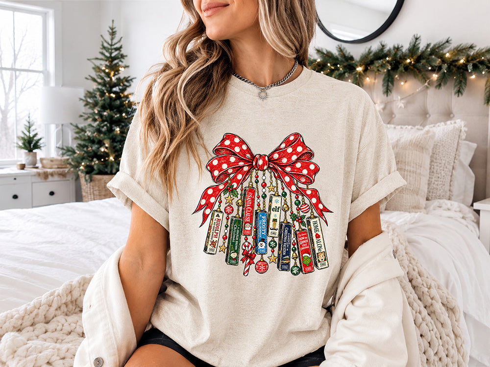 Christmas movie lover DTF transfer featuring a large red polka dot bow with festive holiday movie-inspired books, ornaments, beads, stars and candy canes.