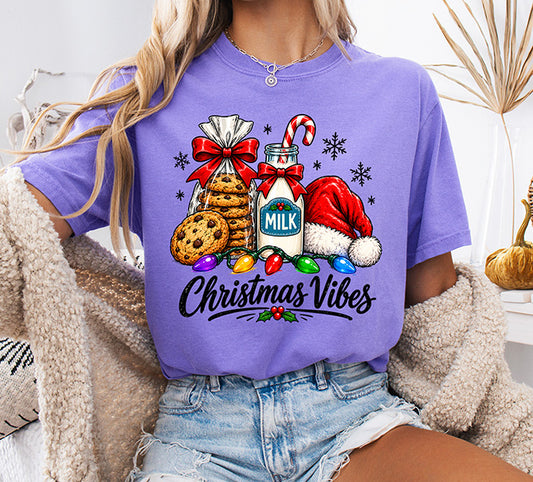 Christmas Vibes DTF transfer featuring chocolate chip cookies, bottle of milk, candy cane, Santa hat, colorful Christmas lights and snowflakes