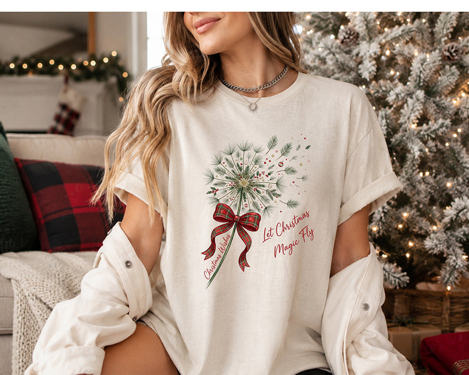 Let Christmas Magic Fly DTF transfer featuring evergreen pine branches, holly and berries tied with a red and green plaid bow and Christmas Wishes ribbon.