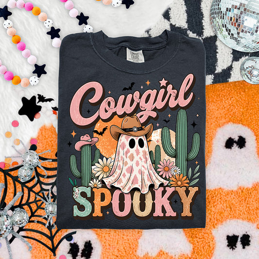 Cowgirl Spooky Halloween DTF transfer featuring pink western ghost in cowboy hat surrounded by cacti flowers bats stars and orange moon