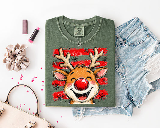 Cute Christmas reindeer DTF transfer featuring a smiling brown reindeer with antlers, bright red nose, distressed red stripes and snowflakes
