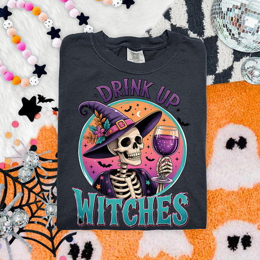 Drink Up Witches Halloween DTF transfer featuring colorful skeleton witch holding a purple drink with retro sunset bats and witch hat