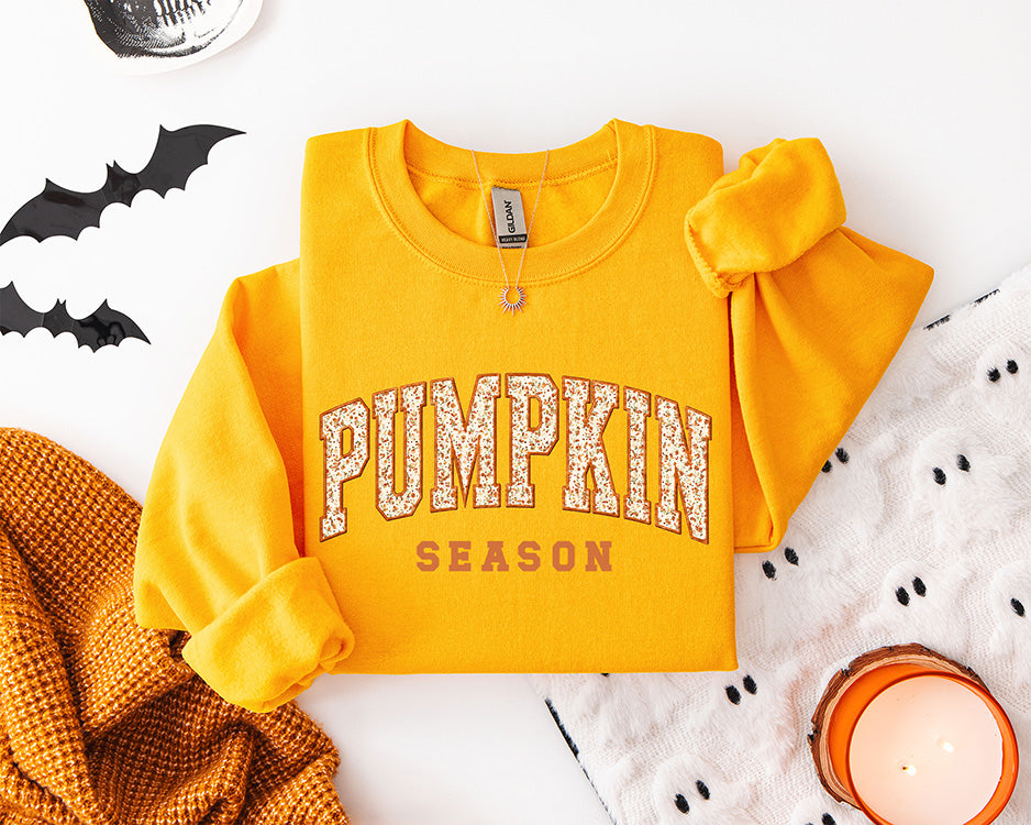 Pumpkin Season vintage collegiate DTF transfer displayed on a golden yellow sweatshirt