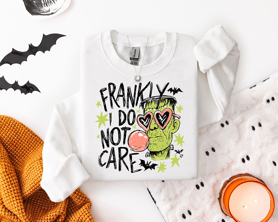 Frankly I Do Not Care Halloween DTF transfer featuring a Frankenstein-inspired green monster with pink heart sunglasses, bubblegum, bats and lime green accents