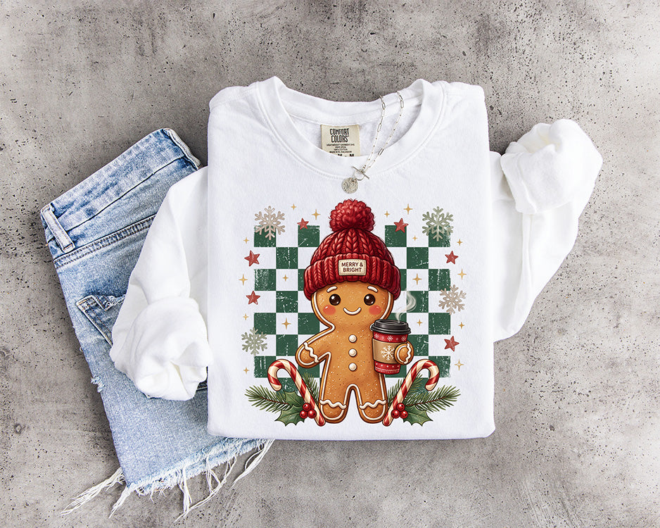 Cute gingerbread Christmas DTF transfer with red winter beanie coffee cup candy canes greenery and green checkerboard background