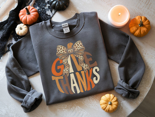 Give Thanks Thanksgiving DTF transfer with pumpkin stem, oversized leopard print bow and warm autumn lettering