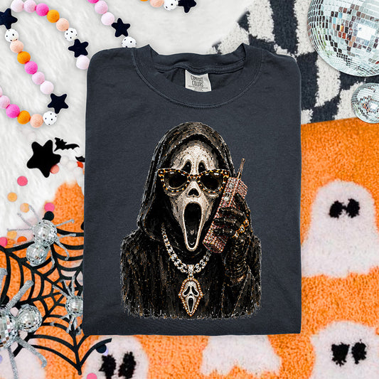 Glam horror inspired Halloween DTF transfer featuring masked character with sunglasses, sparkling jewelry and bling phone