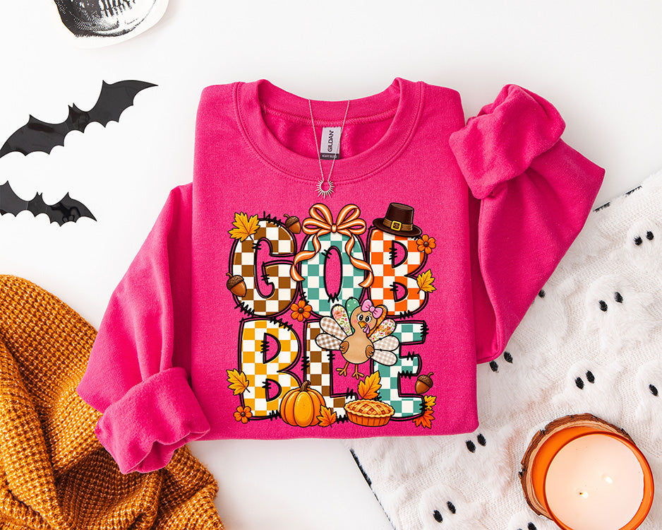 Colorful Gobble Gobble Thanksgiving DTF transfer featuring patchwork lettering, turkey, bows, pumpkins, fall leaves and pumpkin pie
