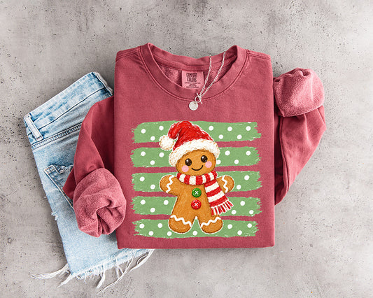 Cute gingerbread Christmas DTF transfer with red Santa hat striped scarf and distressed green polka dot background