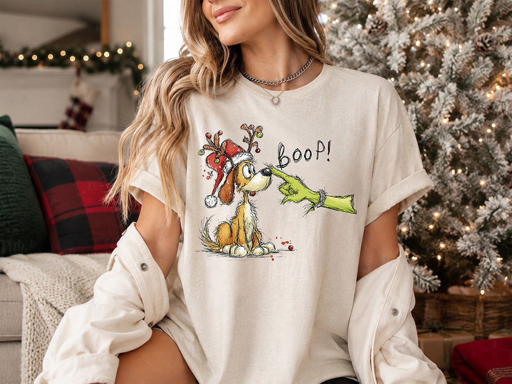 Christmas dog Boop DTF transfer featuring a cute puppy wearing a Santa hat and reindeer antlers getting a playful holiday nose boop.