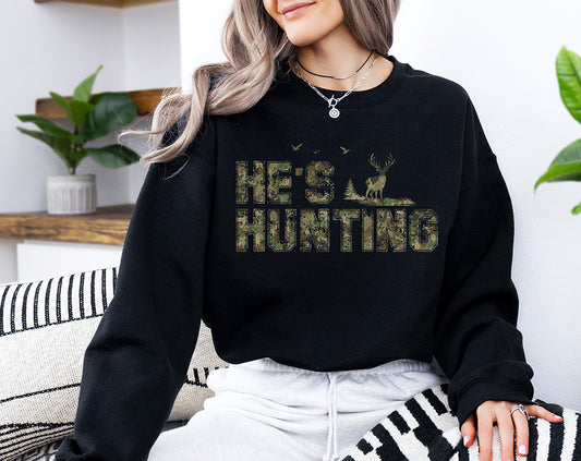 He’s Hunting camo DTF transfer with distressed camouflage lettering, buck, evergreen trees and outdoor hunting details