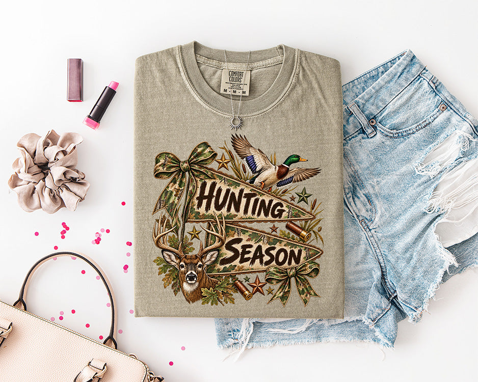 Hunting Season DTF transfer with whitetail buck, flying mallard duck, camouflage bows, antlers, shotgun shells and camo pennant banners
