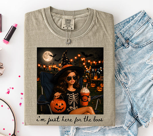 I'm Just Here for the Boos Halloween DTF transfer featuring stylish witch with pumpkin bucket and festive drink surrounded by glowing pumpkins
