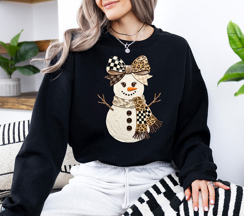 Neutral Christmas snowman DTF transfer featuring an oversized leopard print and black checkered bow with a coordinating leopard and checkered scarf.