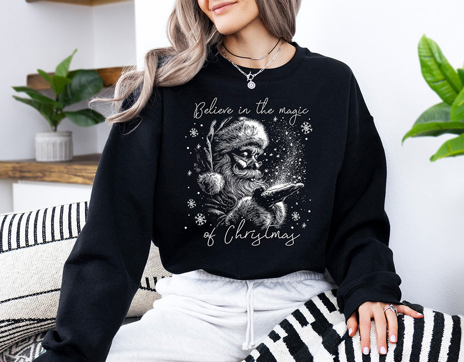 Believe in the Magic of Christmas DTF transfer featuring a vintage black and white Santa holding Christmas magic surrounded by snowflakes and stars.