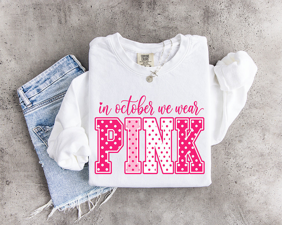 In October We Wear Pink DTF transfer featuring hot pink and light pink polka dot varsity lettering with feminine script