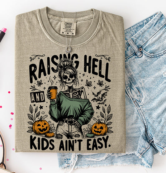 Raising Hell and Kids Ain't Easy Halloween DTF transfer with skeleton mom holding coffee surrounded by pumpkins bats and fall details