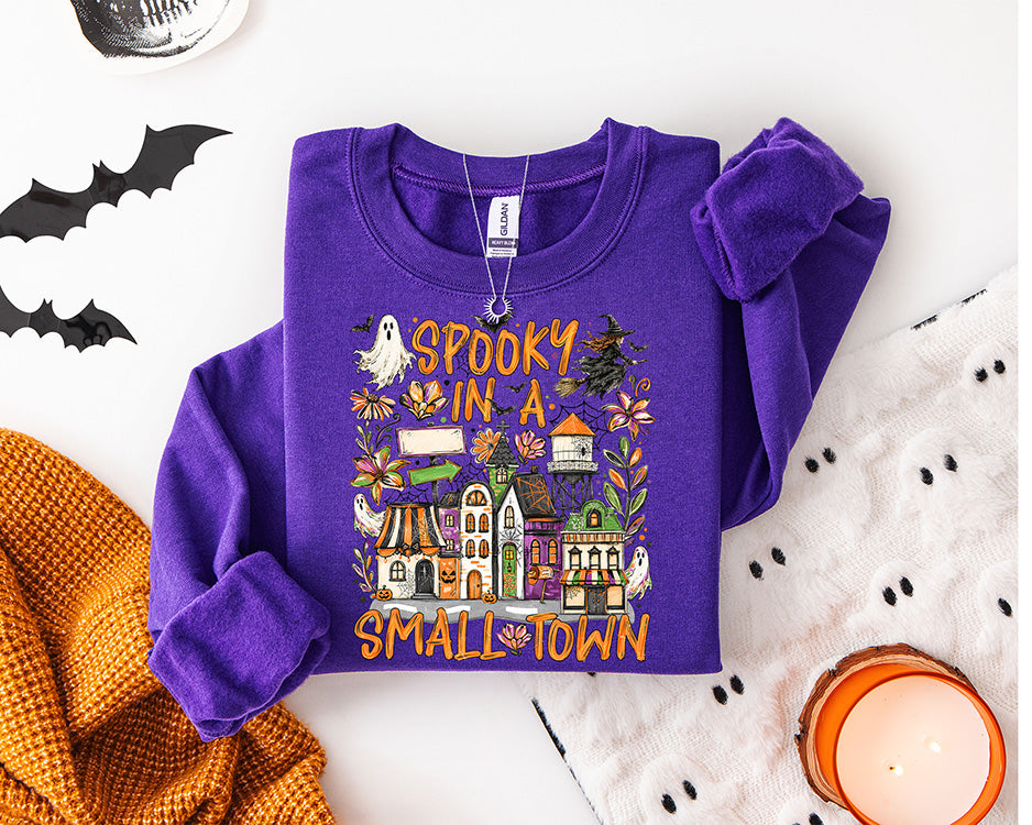 Spooky in a Small Town Halloween DTF transfer with colorful small town buildings cute ghosts bats flowers and spooky season details