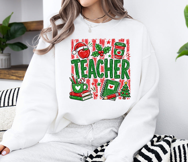 Christmas Teacher DTF transfer featuring green Teacher lettering with a Santa hat apple, coffee cup, books, pencils, notebook, holly, and Christmas tree.