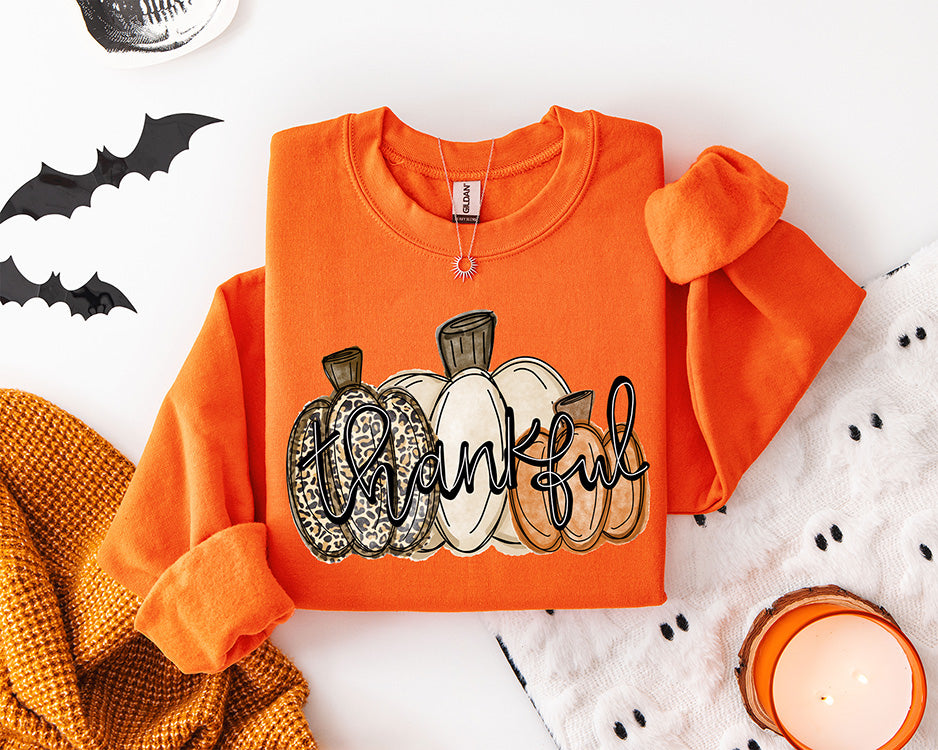 Thankful pumpkins DTF transfer with leopard print cream and orange pumpkins for fall and Thanksgiving apparel