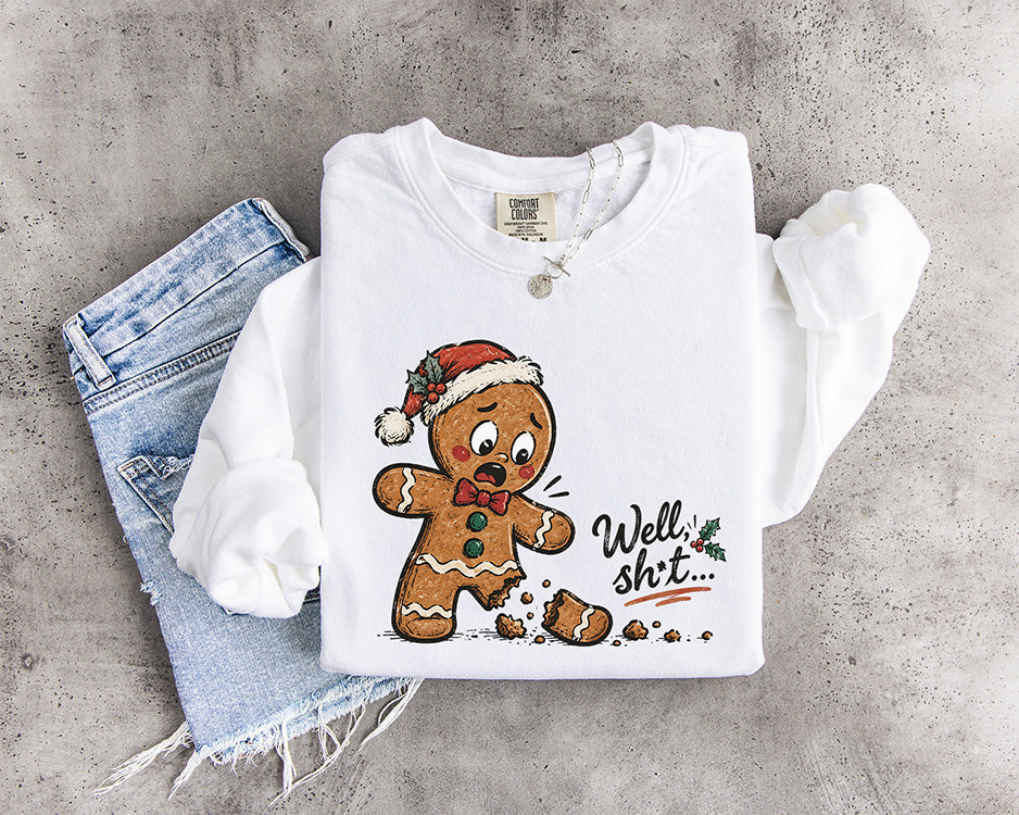 Funny Well Shit gingerbread man Christmas DTF transfer featuring a shocked gingerbread cookie with a broken leg and Santa hat