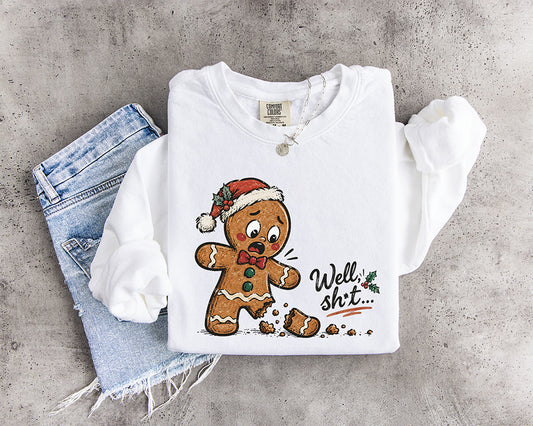 Funny Well Shit gingerbread man Christmas DTF transfer featuring a shocked gingerbread cookie with a broken leg and Santa hat